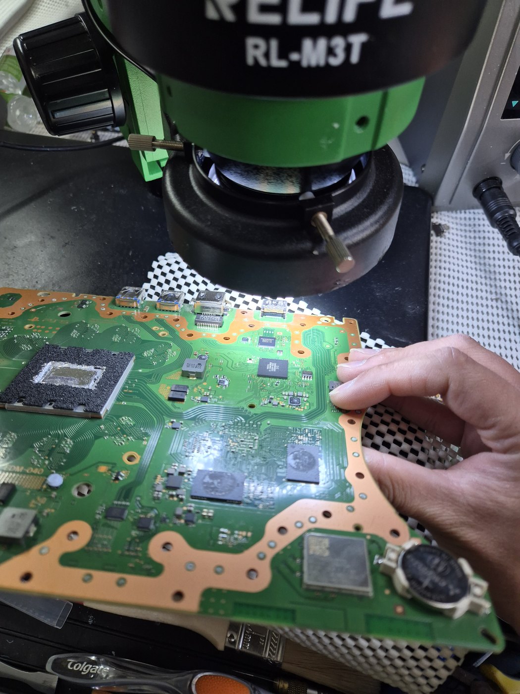 Microscope-assisted circuit board repair at the Scoresby workshop